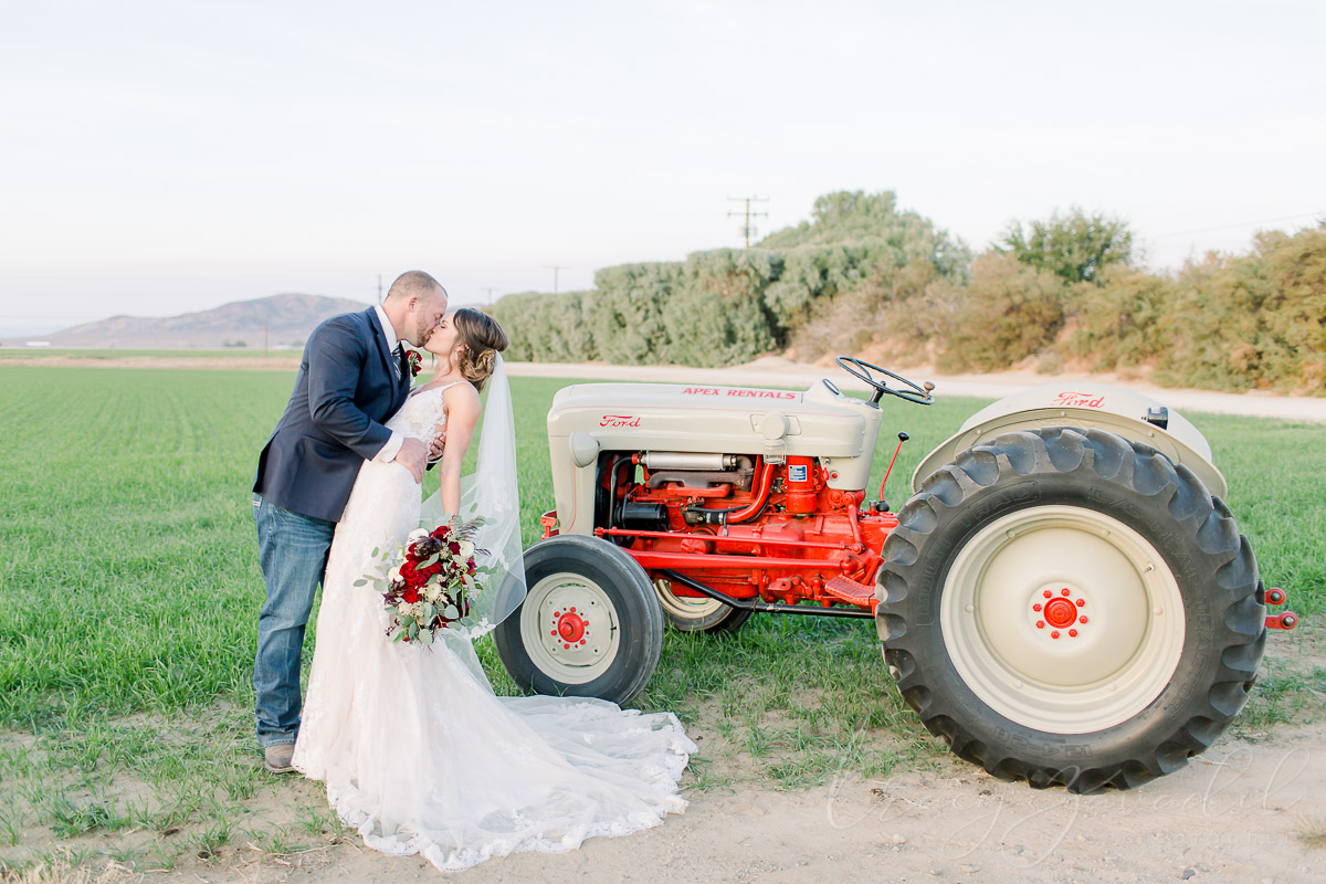 Bride and groom with tractor