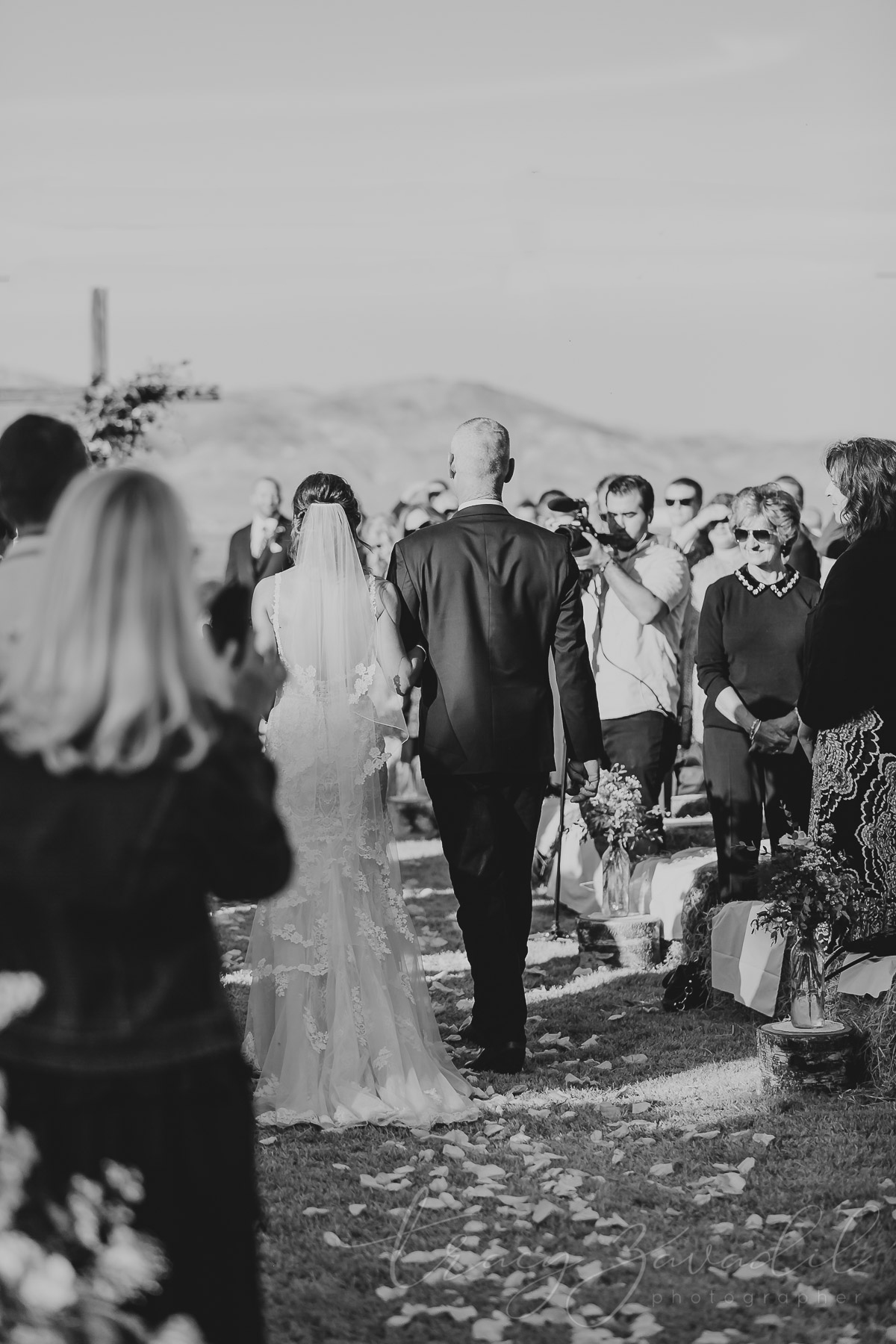Father and Daughter walking down the isle